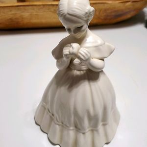 Porcelain figurine of a young woman